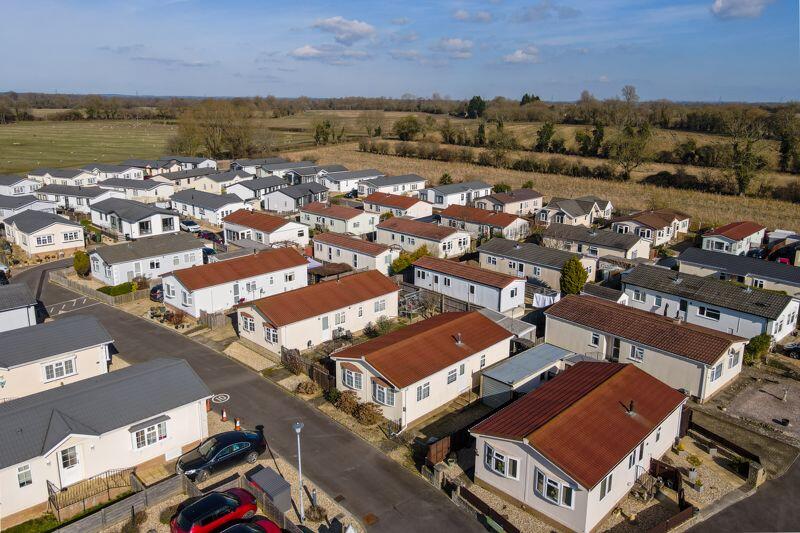 Aerial view of property and surroundi...