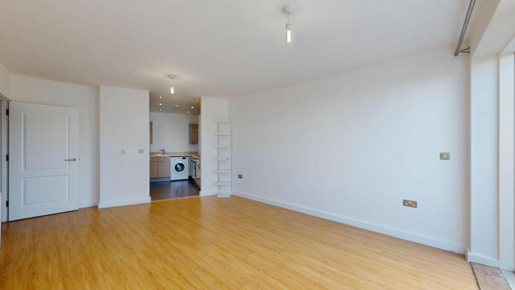 Bright and spacious living room featuring warm ...