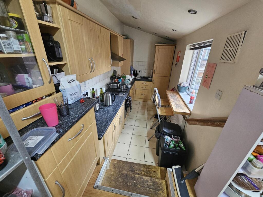 A functional kitchen area with ample counter sp...