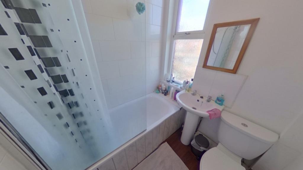 Bright and fresh bathroom featuring a full bath...