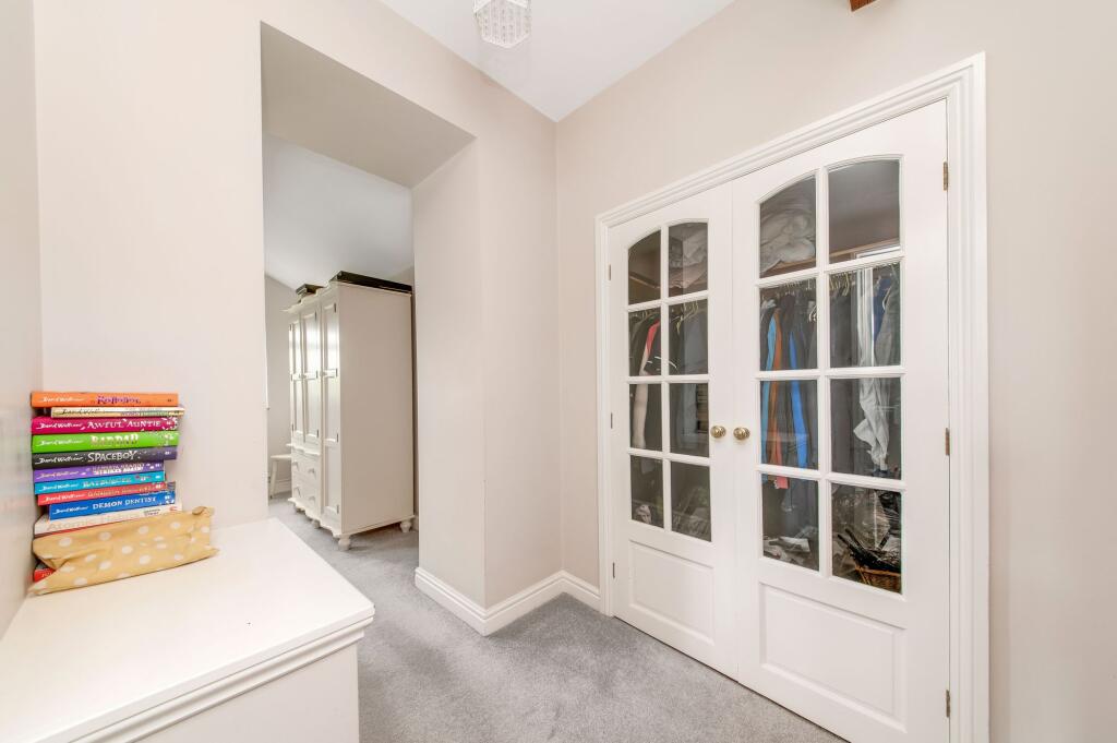 BEDROOM ONE WALK-IN WARDROBE / DRESSING AREA