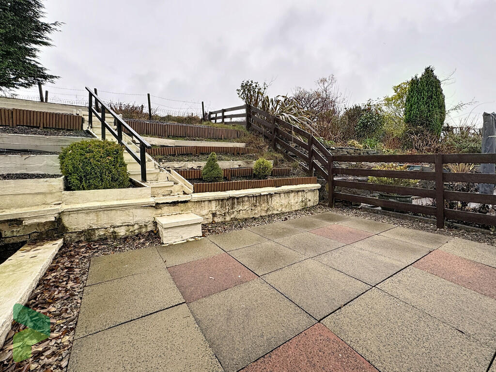 Rear patio and ga...