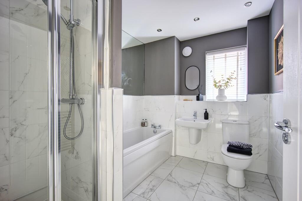 A practical family bathroom with both shower, and bath