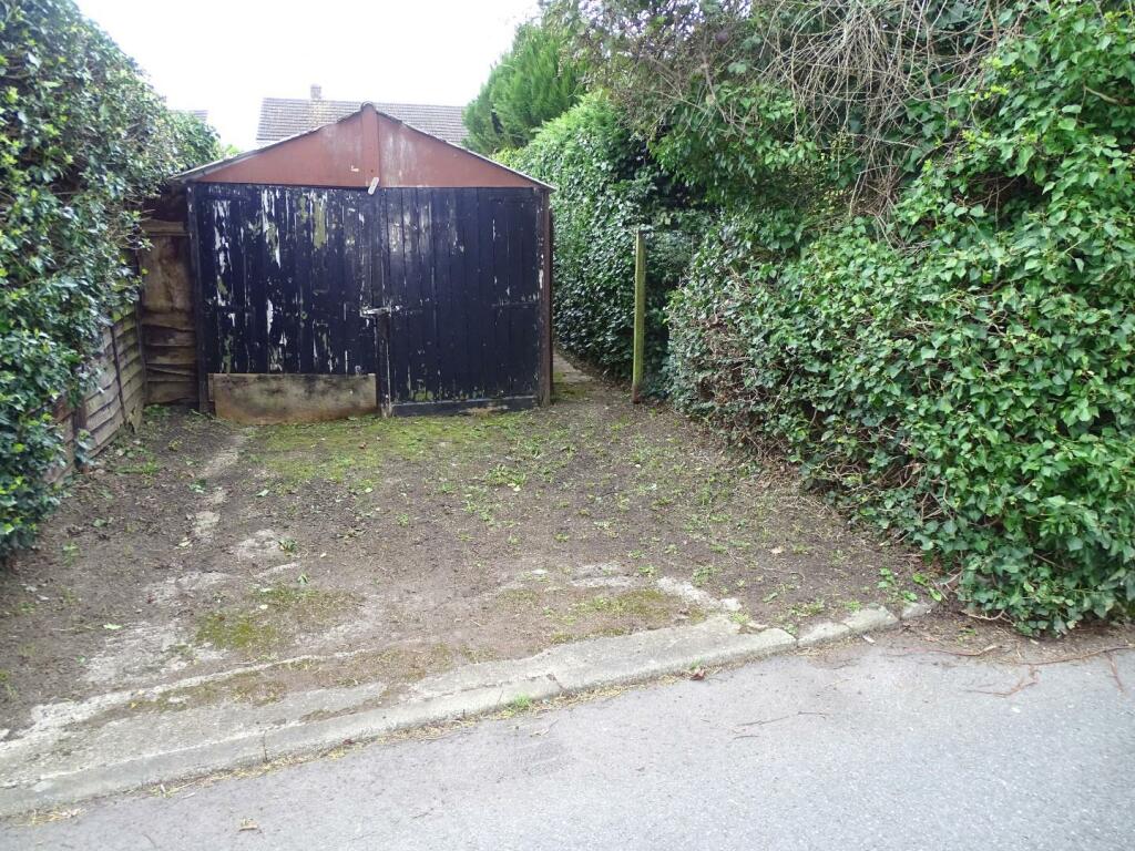 PARKING AND TIMBER GARAGE TO REAR