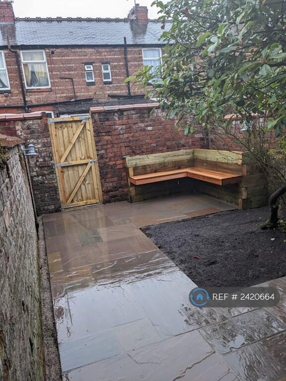Back Yard With Roses And Photinia Tree