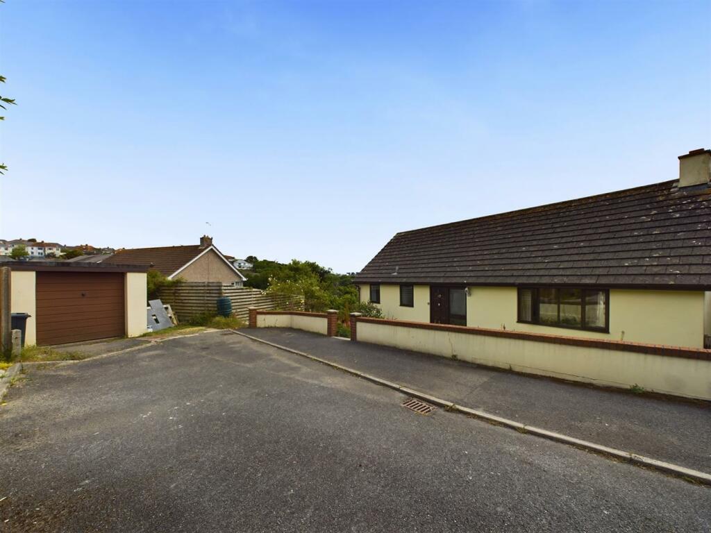 Front elevation, garage and parking