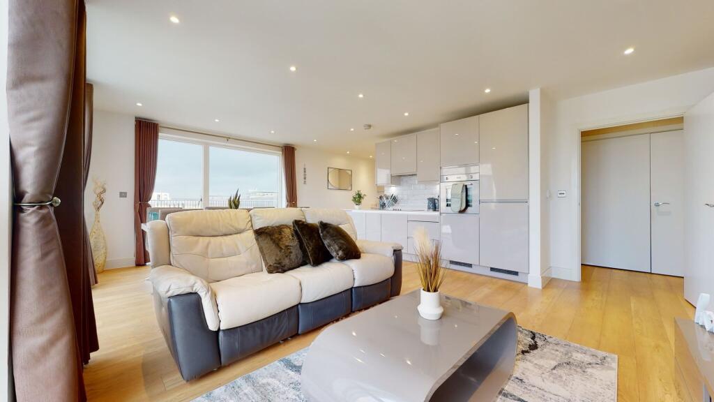 Bright and modern open-plan living room featuri...