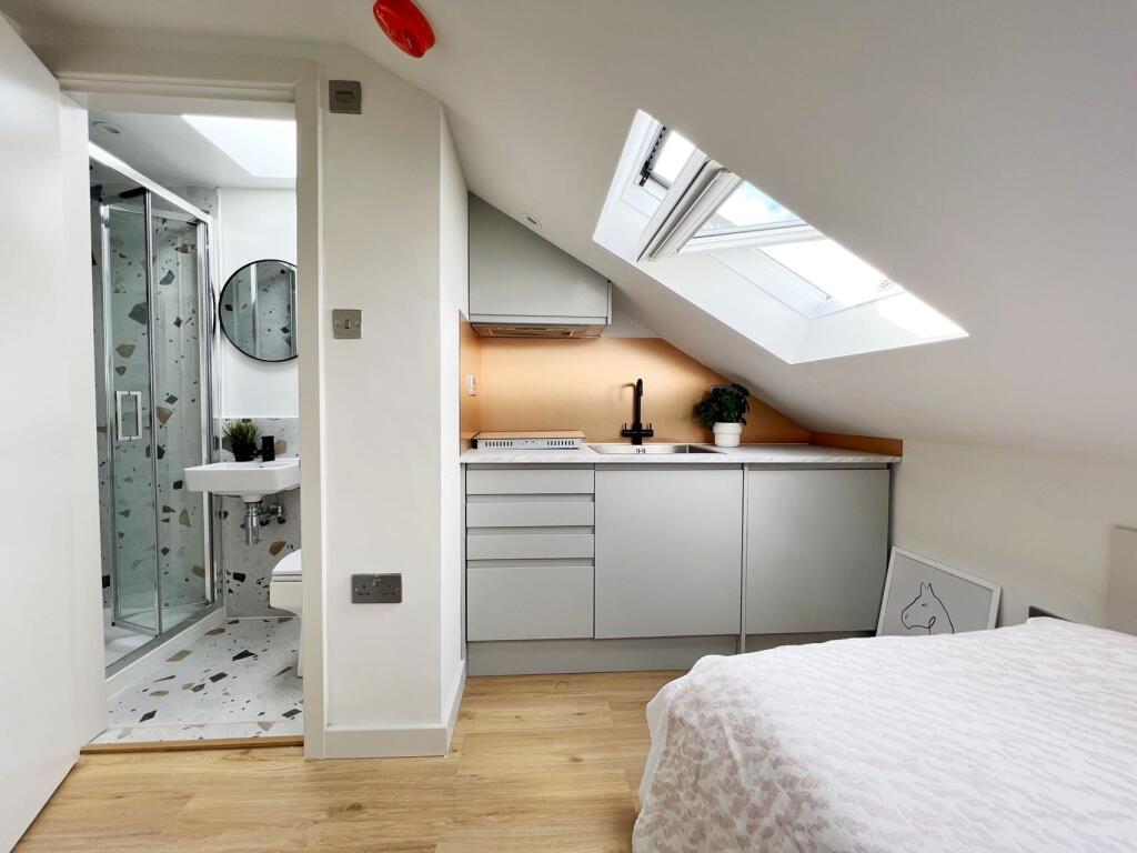 Bright and modern studio space featuring a cozy...