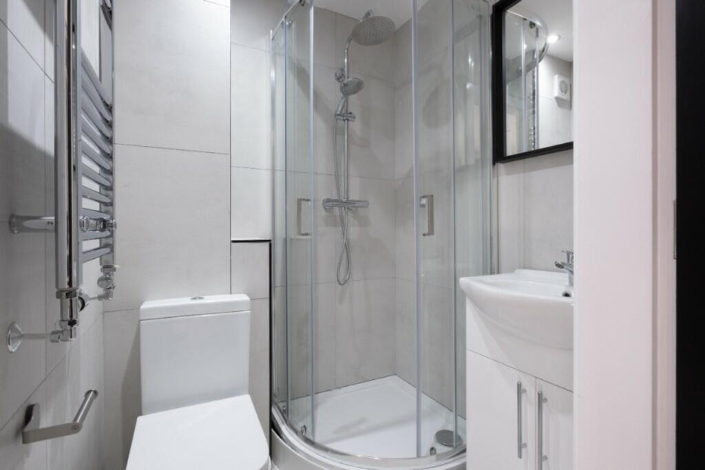 Modern bathroom featuring a sleek design with a...