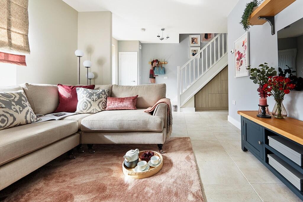 The living room provides a relaxing space at the front of the home for the family