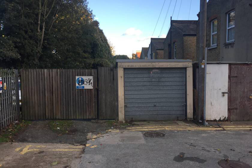 A large plot of land, with fencing around it.
