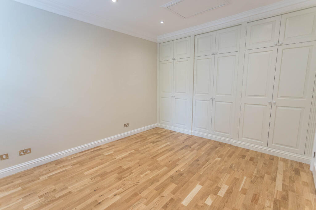 Bedroom 2 with wardrobes