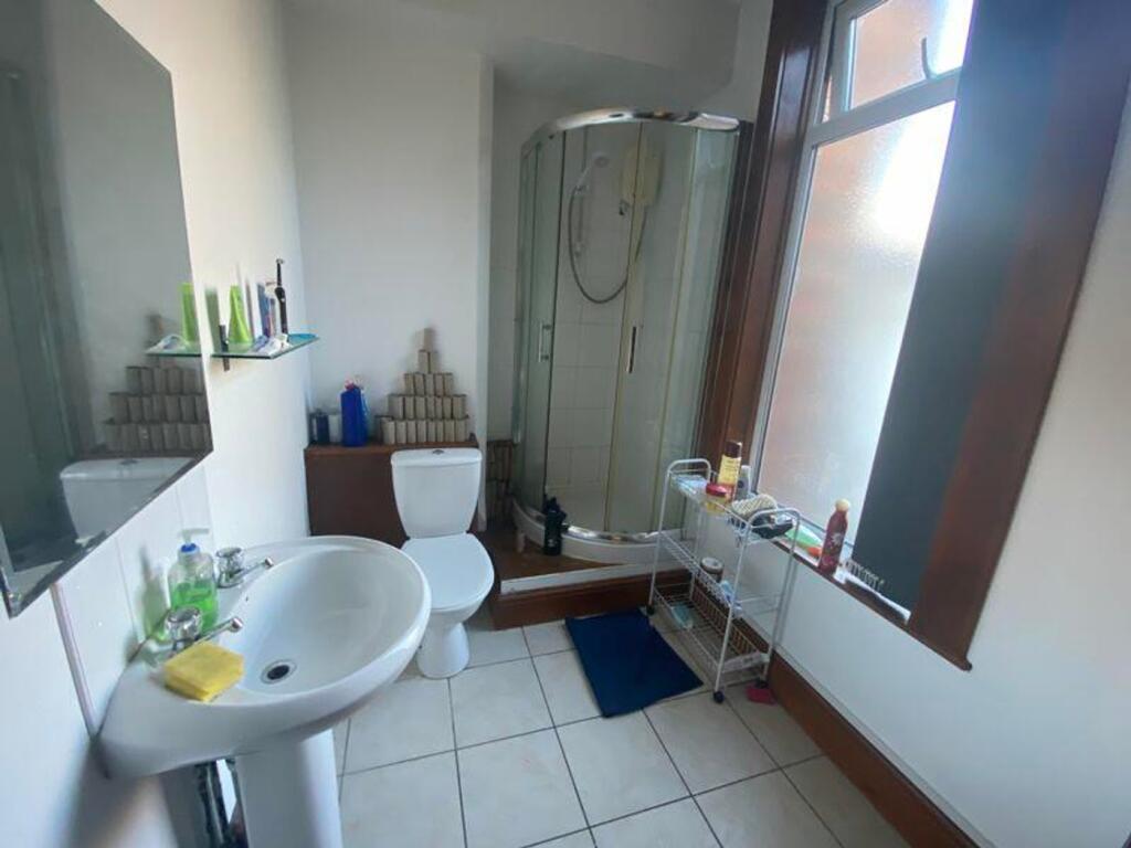 A bright and tidy bathroom featuring modern fix...
