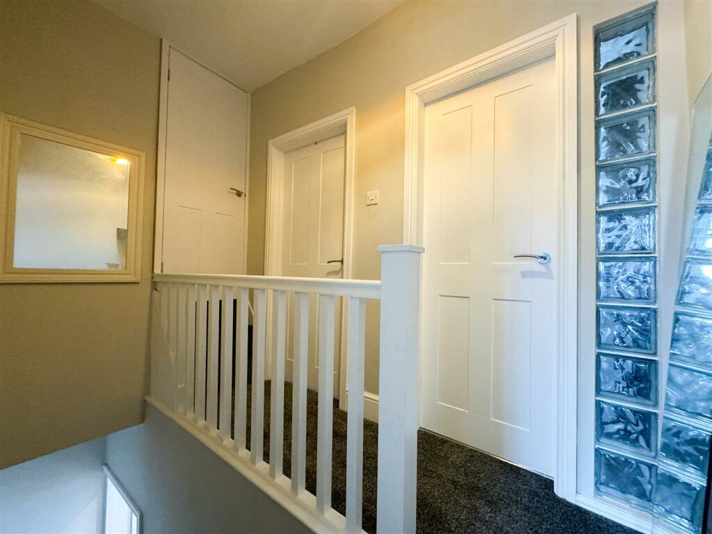 STAIRS RISING TO THE FIRST FLOOR