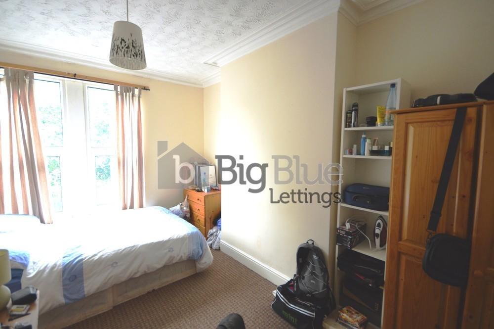 Bright and cozy double bedroom featuring a larg...