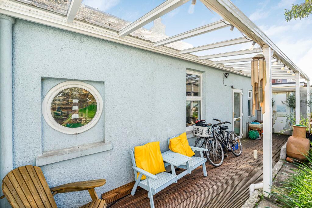 Undercover seating area to the rear of the property