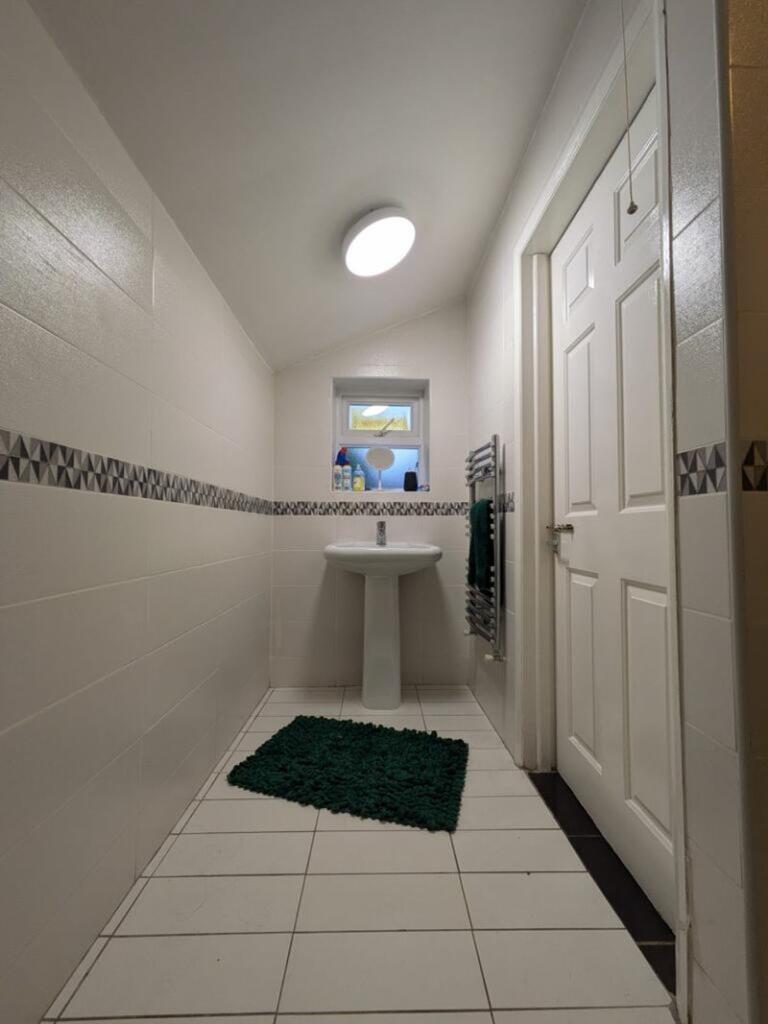 A bright and clean bathroom featuring a modern ...