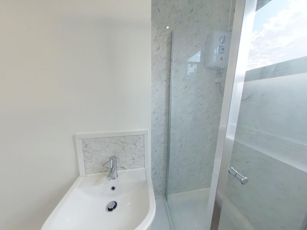 A bright and modern bathroom featuring a sleek ...