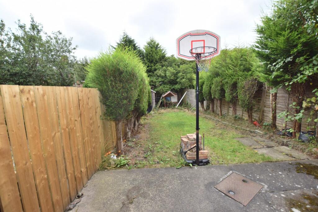 A well-maintained garden space featuring a bask...