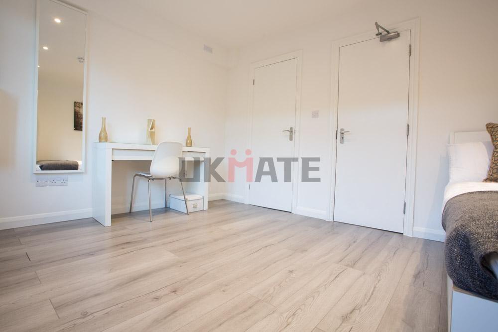 A bright, well-maintained bedroom featuring a s...