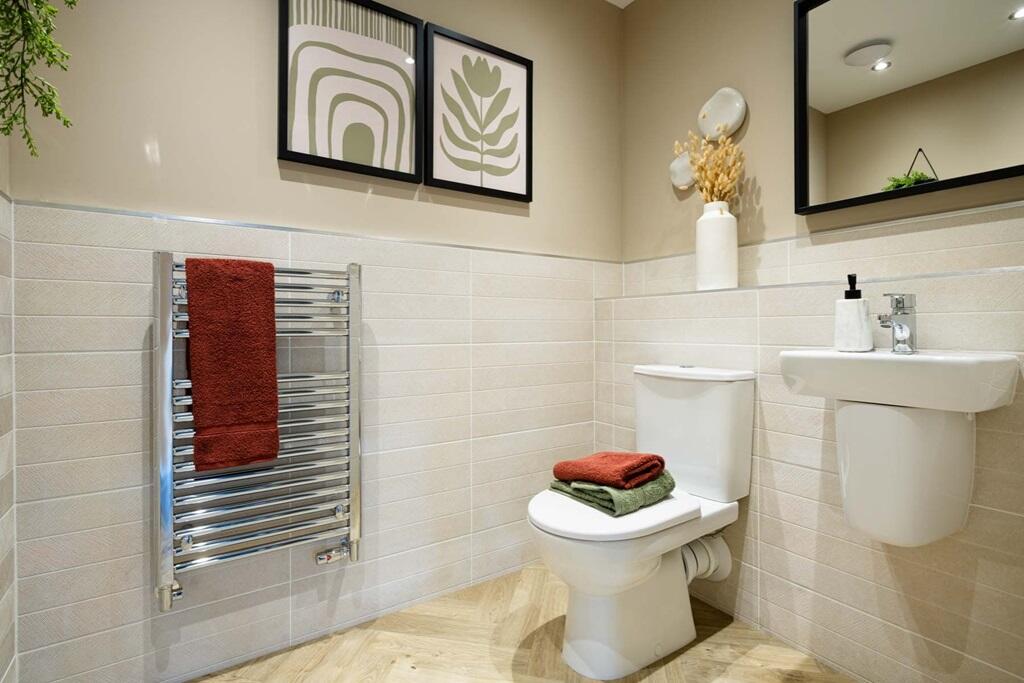 A downstairs cloakroom adds convenience