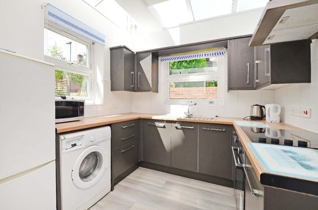 Bright and modern kitchen with ample countertop...