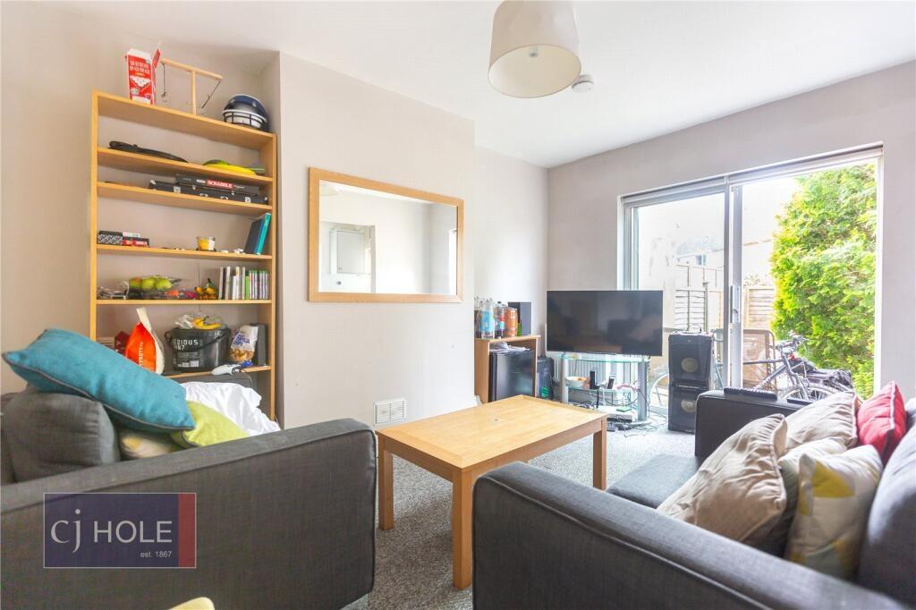 Bright and cozy living room featuring comfortab...