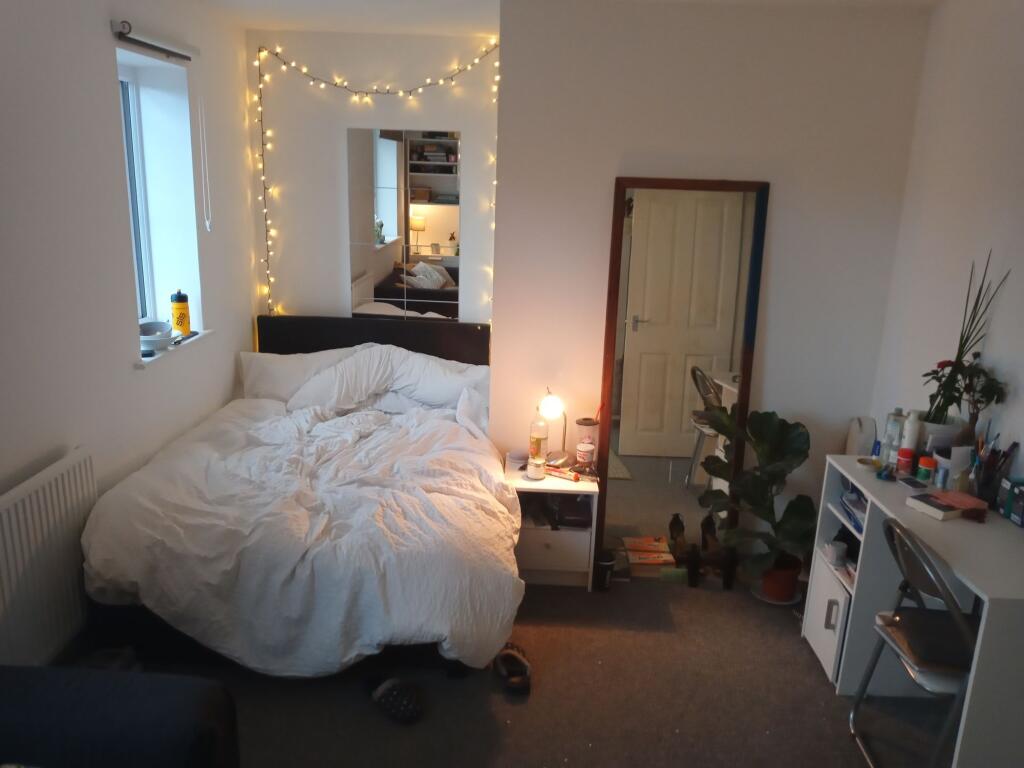 Cozy double bedroom with a comfy double bed, be...
