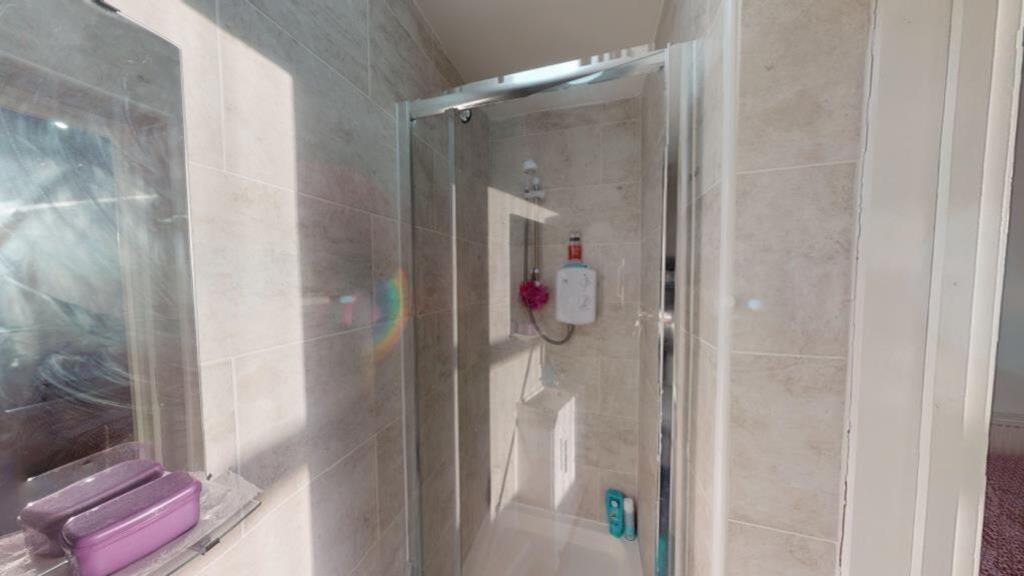 A bright and clean bathroom featuring modern fi...