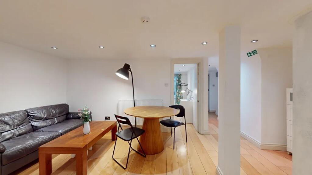 A modern living room featuring a comfortable bl...