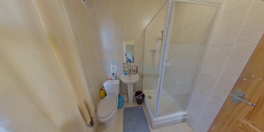 A clean and modern bathroom featuring a spaciou...
