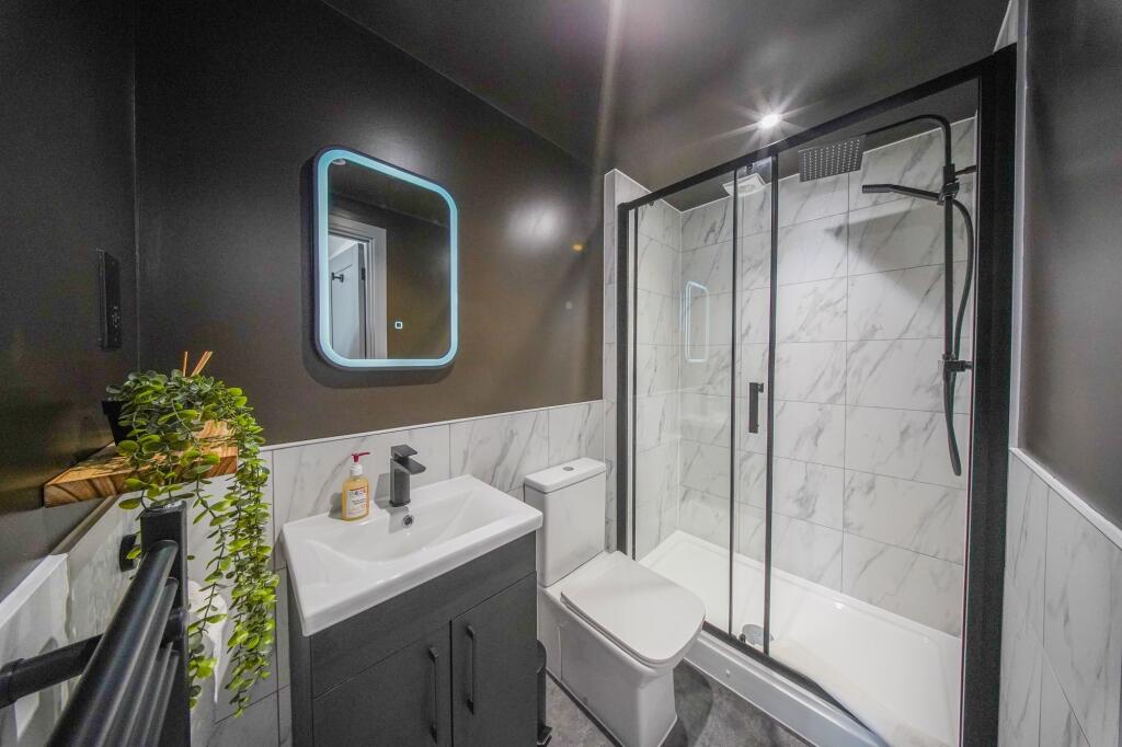 A modern, well-maintained bathroom featuring a ...