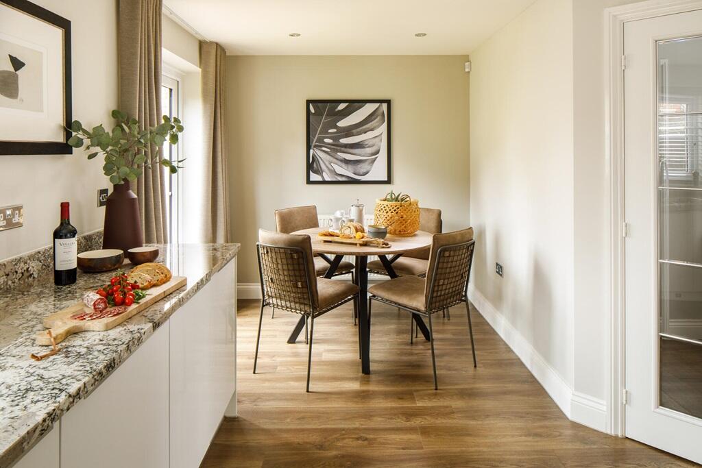 With French doors to the rear garden and separate utility