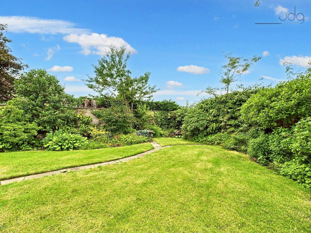 Garden with patio seating area