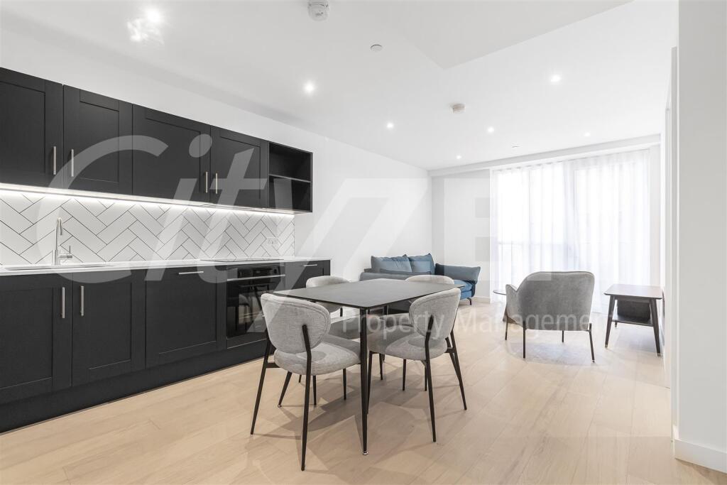 DINING AREA/KITCHEN (PHOTO OF SIMILAR APARTMENT)