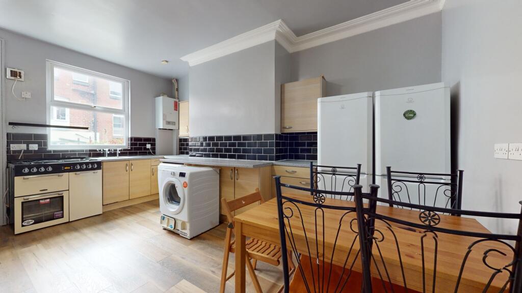 Bright and tidy kitchen with natural light, fea...