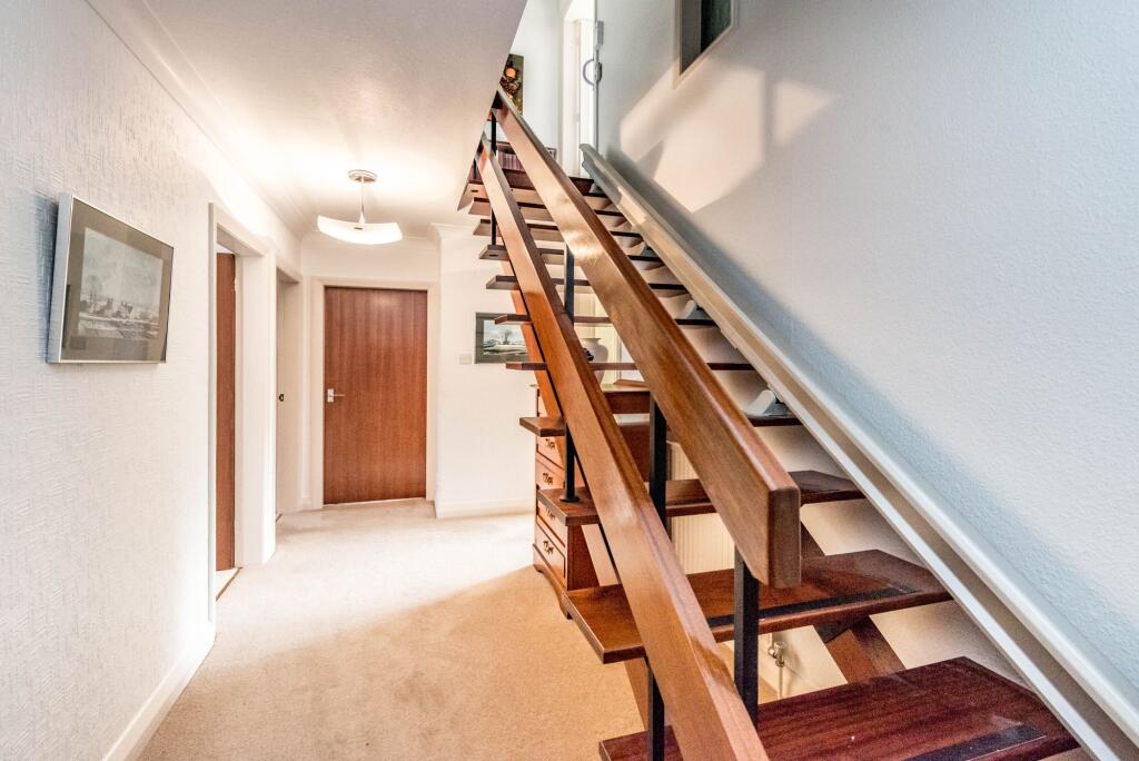 ENTRANCE HALLWAY AND UTILITY ROOM