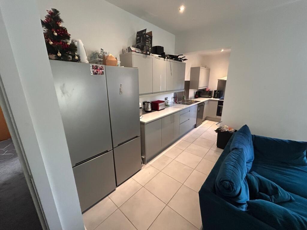 A modern kitchen with sleek cabinetry, stainles...