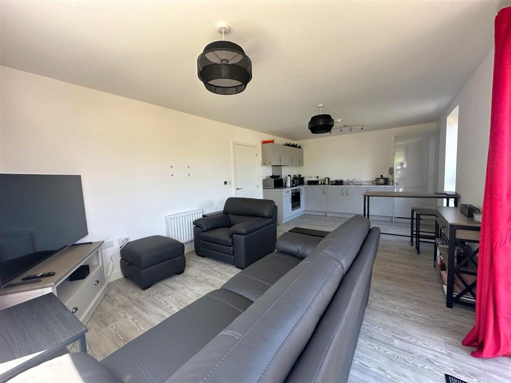Living Room with Kitchen Area