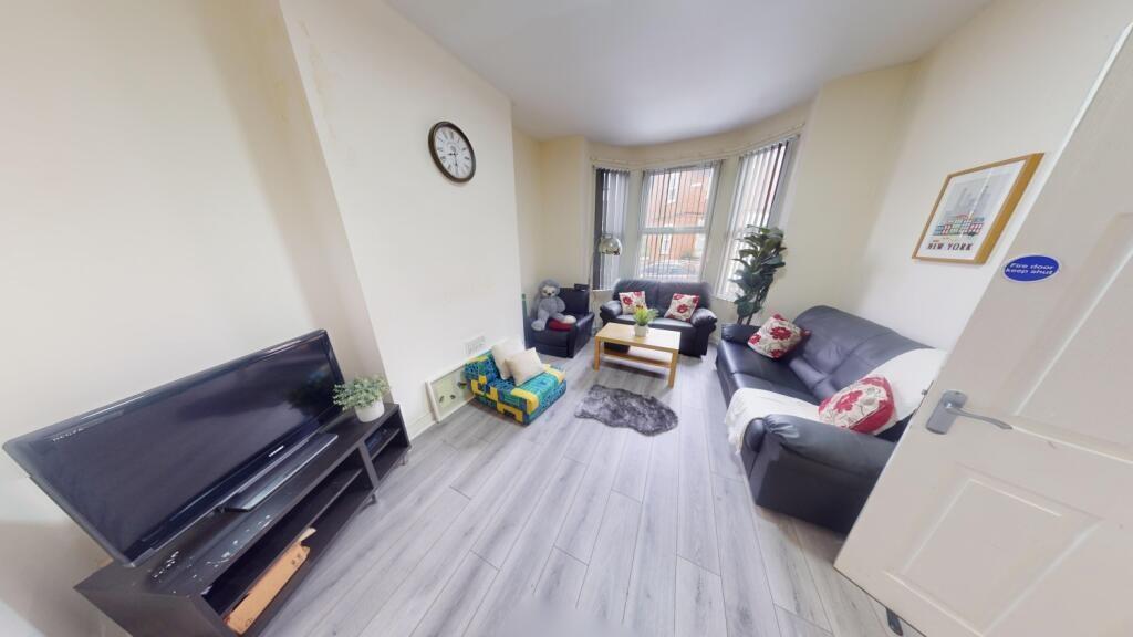 Bright and inviting living room featuring a lar...