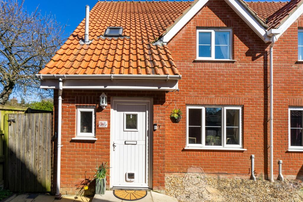 Front View with Driveway and Side Access to the Ga