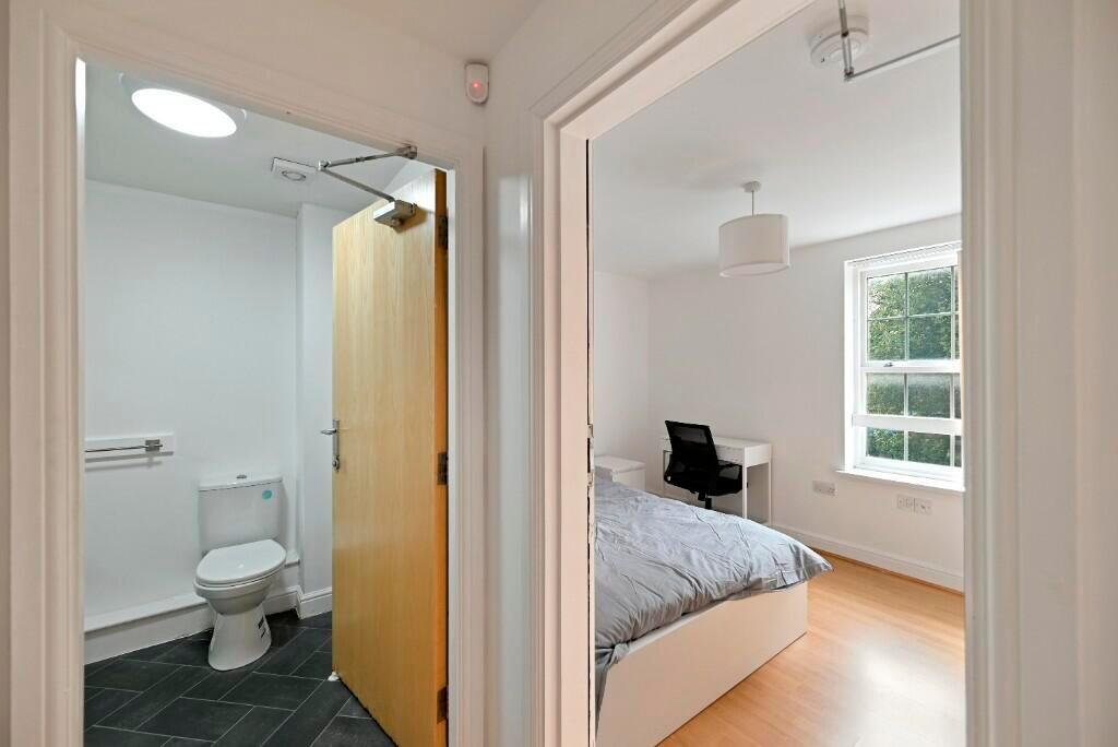 Bright and airy double bedroom featuring a comf...