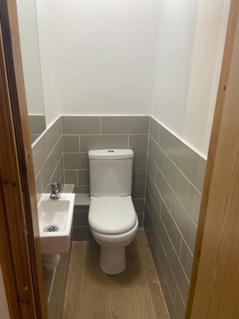 A modern and clean bathroom featuring a stylish...