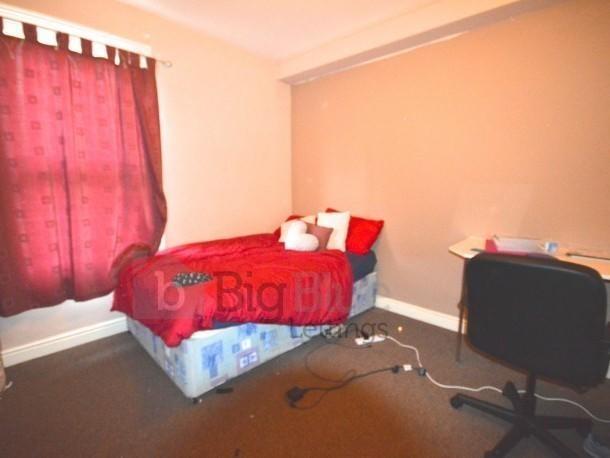 Cozy single bedroom featuring a comfortable sin...