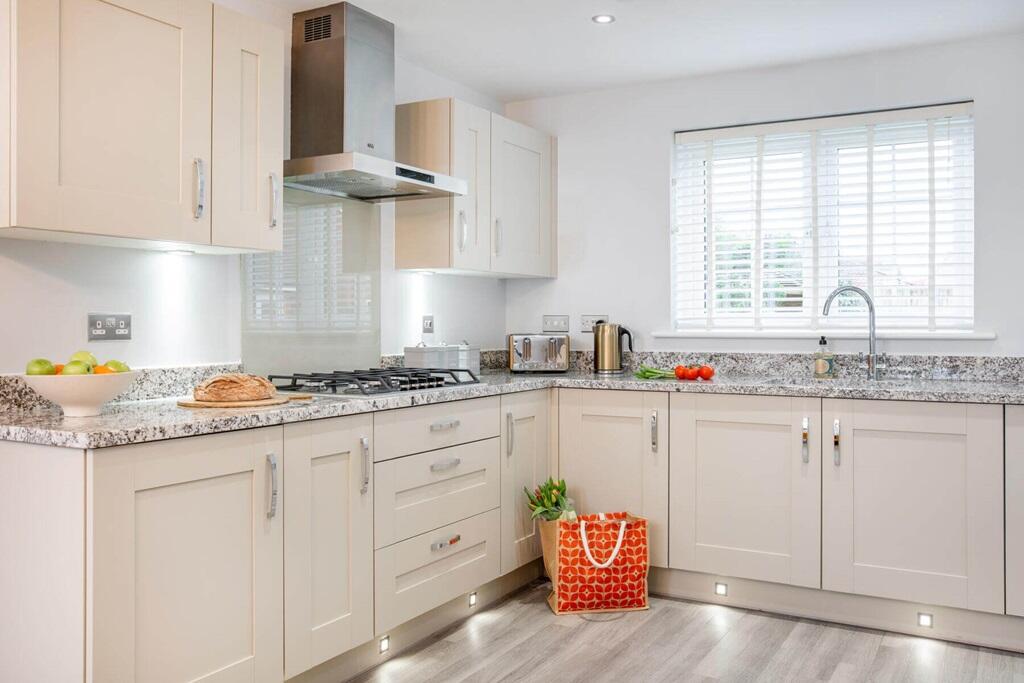 The kitchen/dining area features high quality fixtures and fittings