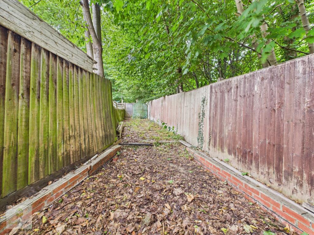 Section Of  Rear Garden Giving Access To Double Ga