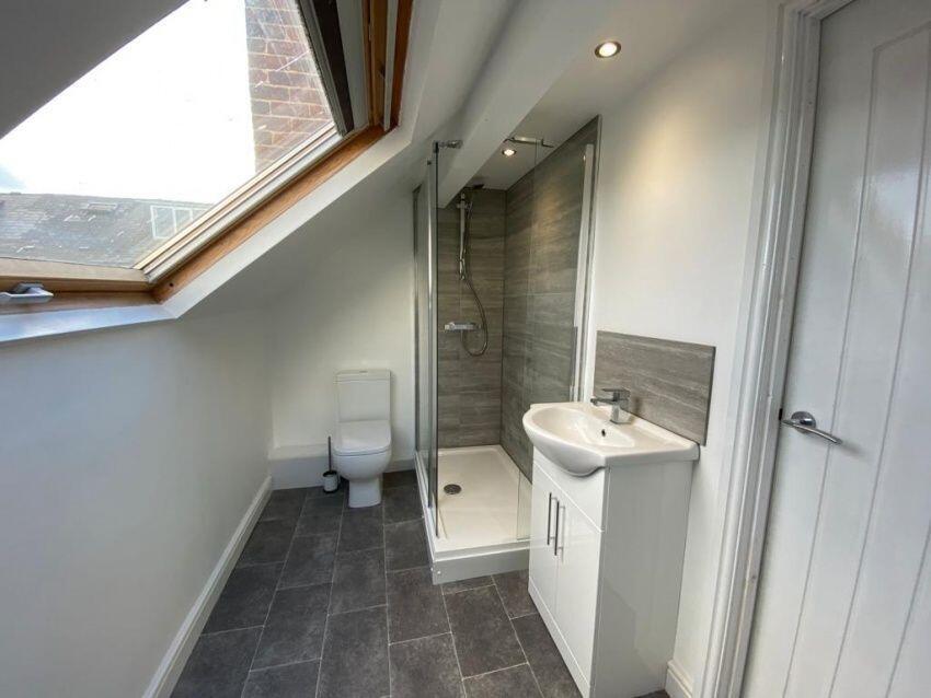 A modern bathroom suite featuring a spacious wa...