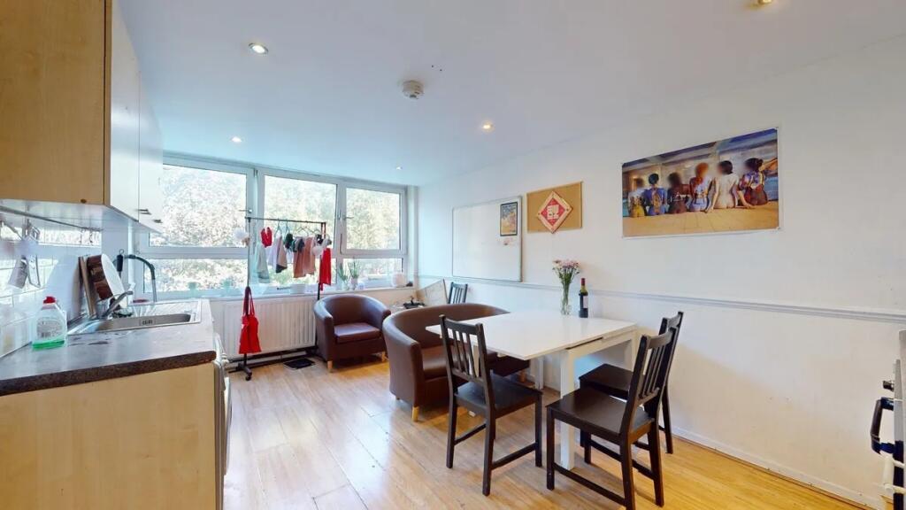 Bright and functional kitchen area featuring la...