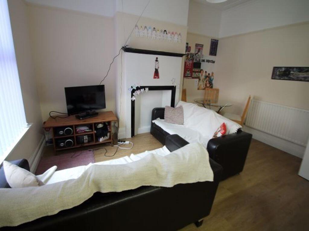 A comfortable and well-lit living room with mod...