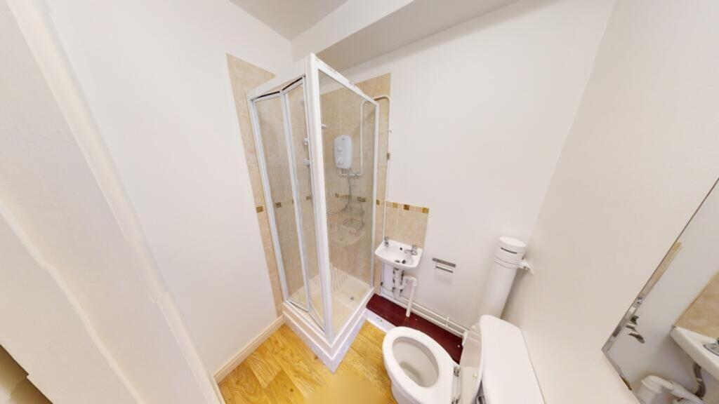 A clean and modern bathroom featuring a spaciou...